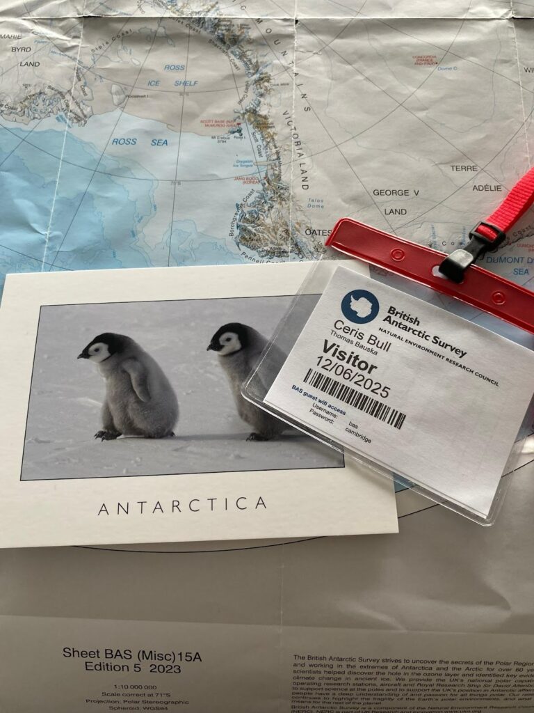 Image of Ceris' British Antarctic Survey visitor pass and Antarctica postcard